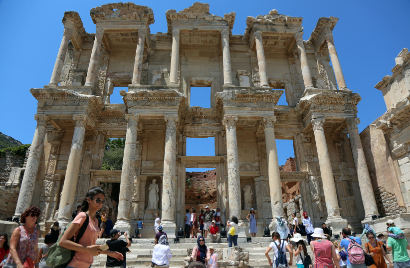  Tourists visit the Celsius Library in the ancient city of Ephesus near Izmir in the western Aegean region, Turkey August 5, 2018. Picture taken August 5, 2018.  (credit: REUTERS/SERTAC KAYAR)