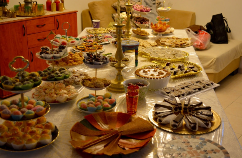  Mimouna table at the Arviv family in Ashkelon, Israel. (credit: YONA ABEDDOUR)