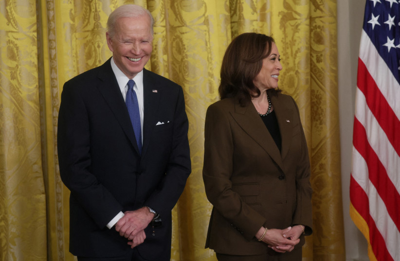  US President Joe Biden and Vice President Kamala Harris listen as former US President Barack Obama speaks about the Affordable Care Act and Medicaid at the White House in Washington, US, April 5, 2022.  (photo credit: REUTERS/LEAH MILLIS)