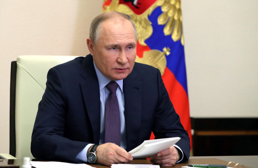 Russia's President Vladimir Putin chairs a meeting on the country's oil and gas industry with representatives of Russian energy companies and officials via a video link at a residence outside Moscow, Russia April 14, 2022. (photo credit: SPUTNIK/MIKHAIL KLIMENTYEV/KREMLIN VIA REUTERS)