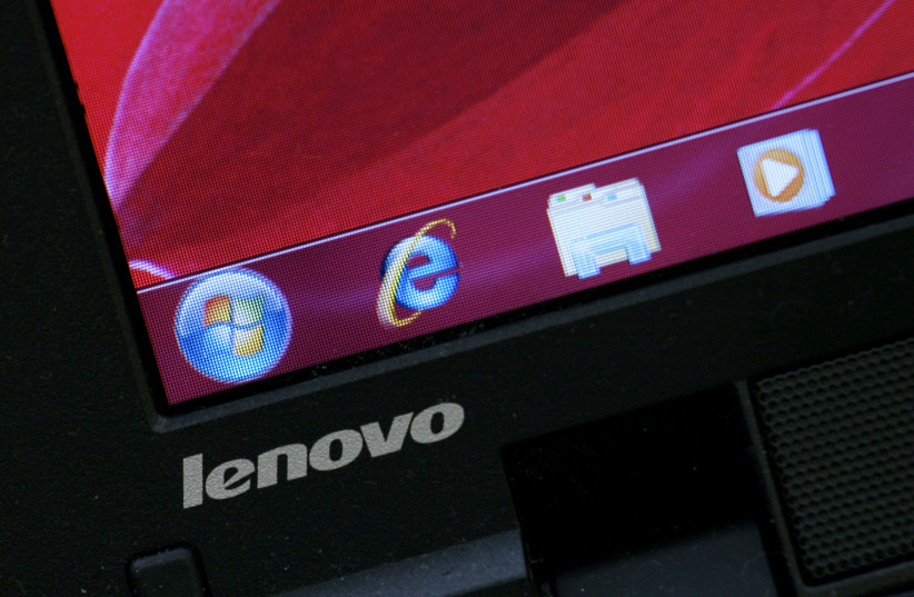  A Lenovo laptop computer is displayed with the Microsoft Windows 7 operating system at a computer store in Hong Kong November 5, 2009 (photo credit: REUTERS/BOBBY YIP)
