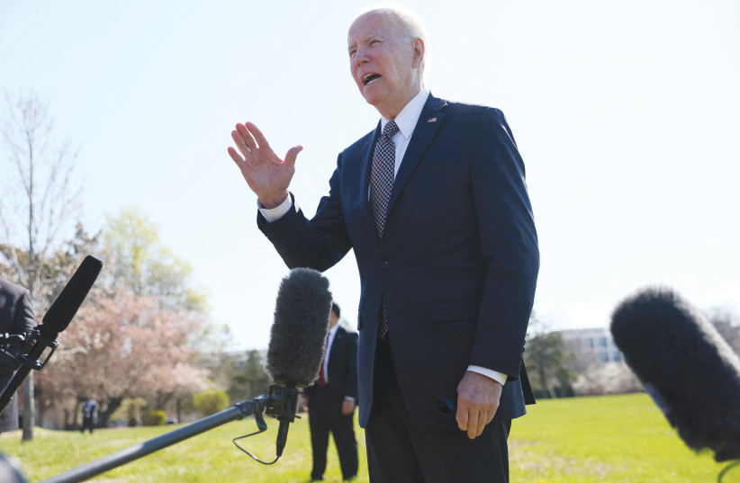  US PRESIDENT Joe Biden stops to speak to reporters at Fort McNair Army Base in Washington, earlier this month, charging that Vladimir Putin is a war criminal and saying he’ll call for a war crimes trial. (photo credit: LEAH MILLIS/REUTERS)