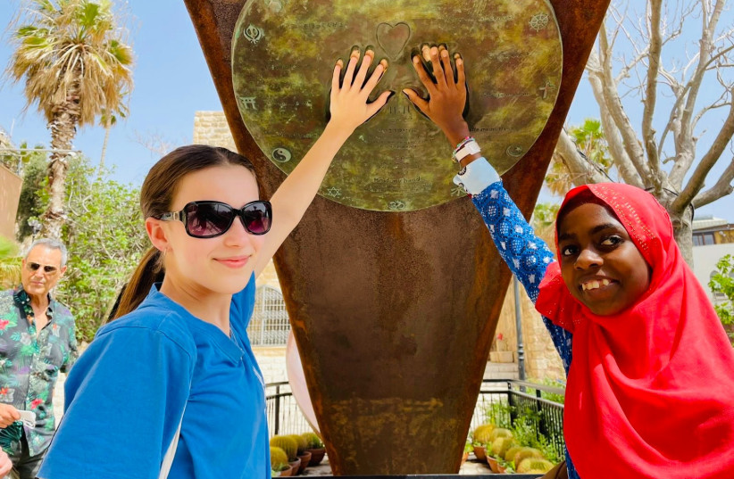Amelie Anderson, 12, raised funds for Salma, 15, to receive life-saving heart surgery in Israel (photo credit: COURTESY OF SAVE A CHILD'S HEART)