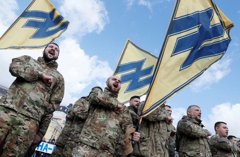  Members of Azov battalion attend a rally on the Volunteer Day honouring fighters, who joined the Ukrainian armed forces during a military conflict in the country's eastern regions, in central Kiev, Ukraine March 14, 2020. (photo credit: REUTERS/GLEB GARANICH)