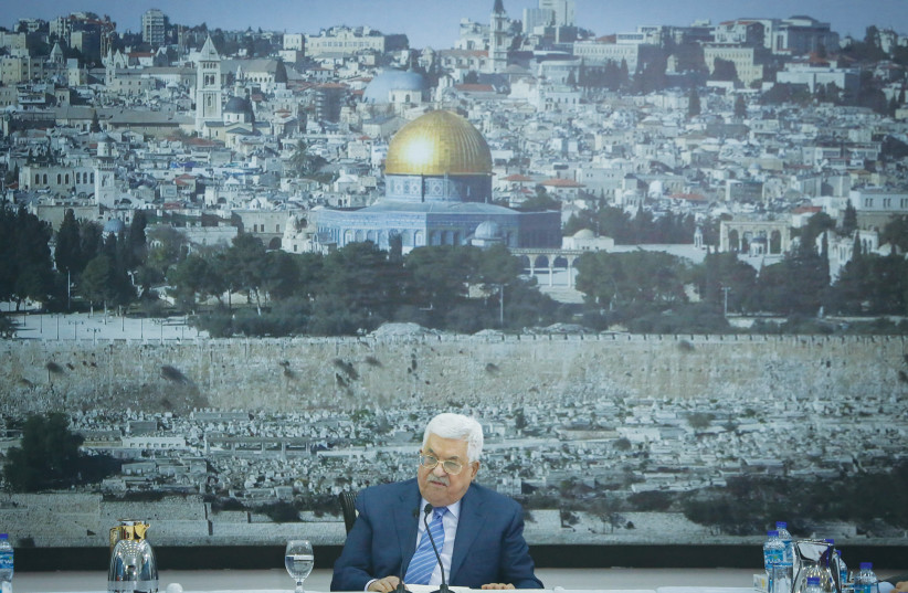 PALESTINIAN AUTHORITY head Mahmoud Abbas speaks at a meeting of the Palestinian leadership in Ramallah, with a large photo of the Dome of the Rock in the background. Abbas has stoked a broad-scale campaign against the authenticity of Israel’s historic rights in Jerusalem.  (photo credit: FLASH90)