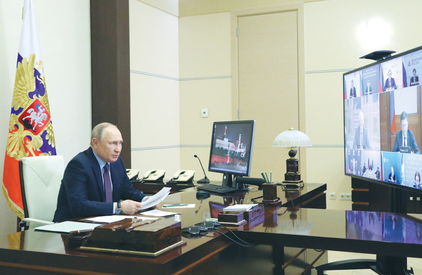  RUSSIAN PRESIDENT Vladimir Putin chairs a meeting with representatives of energy companies last week. If your country encompasses more land than any other in the world, do you really need another tree? (photo credit: Sputnik/Kremlin/Reuters)