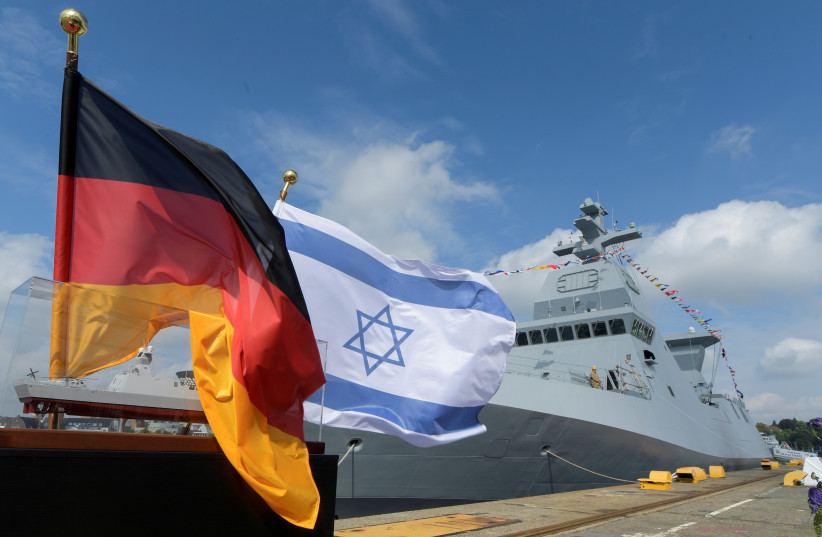  A German and an Israeli flag are pictured in front of the warship "Atzmaut" (Independence, in Hebrew), built by a German company ThyssenKrupp Marine Systems (TKMS), during a handover ceremony, in Kiel, Germany July 27, 2021.  (photo credit: REUTERS/FABIAN BIMMER)