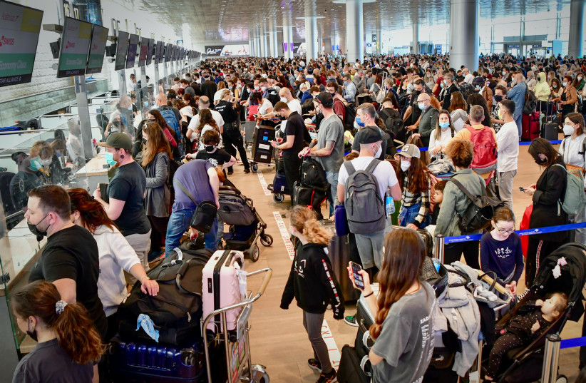  Travellers at the departure halls of Ben Gurion International Airport ahead of the Jewish holiday of Passover. April 14, 2022.  (photo credit: AVSHALOM SASSONI/FLASH90)