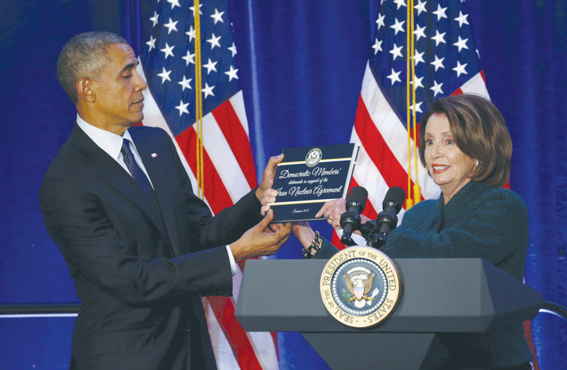  HOUSE DEMOCRATIC leader Nancy Pelosi presents then-US president Barack Obama with a book in 2016 containing Democratic members’ statements of support for the Iran nuclear agreement. Obama ignored concerns of Gulf allies about the threat posed by Iran.  (photo credit: KEVIN LAMARQUE/REUTERS)