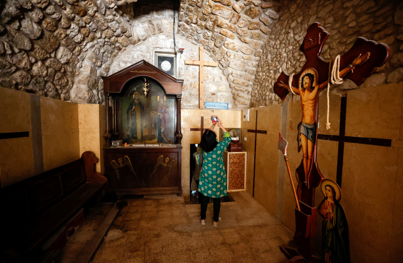  Few steps away from Jerusalem's Church of the Holy Sepulchre, visitors discover an underground cistern with a musical surprise (photo credit: AMMAR AWAD/REUTERS)