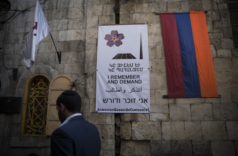  An Armenian flag and a remembrance day poster hangs in the Armenian Quarter of Jerusalem's Old City, as the Armenian community marks the 100th anniversary of the Armenian Genocide, on April 24, 2015. (credit: HADAS PARUSH/FLASH90)