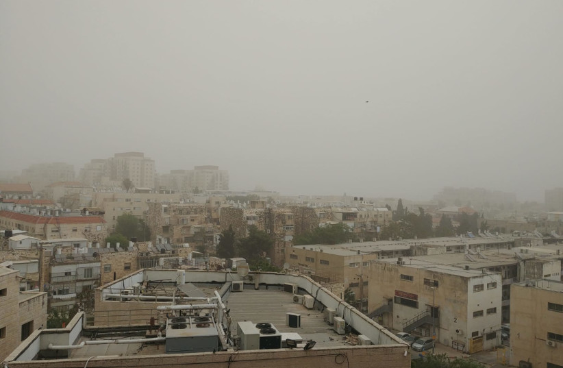  Dusty fog envelopes the rooftops of Jerusalem. (credit: ARIELLA MARSDEN)