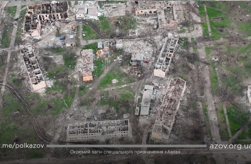  An aerial view shows damaged buildings, amid Russia's ongoing invasion of Ukraine, in Mariupol, Ukraine in this handout picture taken with a drone released April 24, 2022.  (credit: Azov Handout/ via REUTERS)