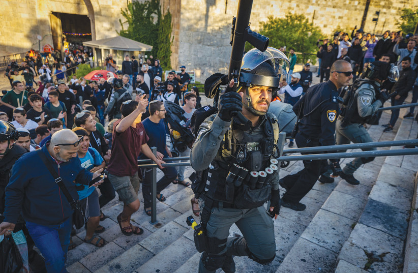 Israelis holding a march are escorted away by Border Police from Damascus Gate in Jerusalem’s Old City last Wednesday, after the marchers ignored a police order to stay away from the area. (photo credit: OLIVER FITOUSSI/FLASH90)