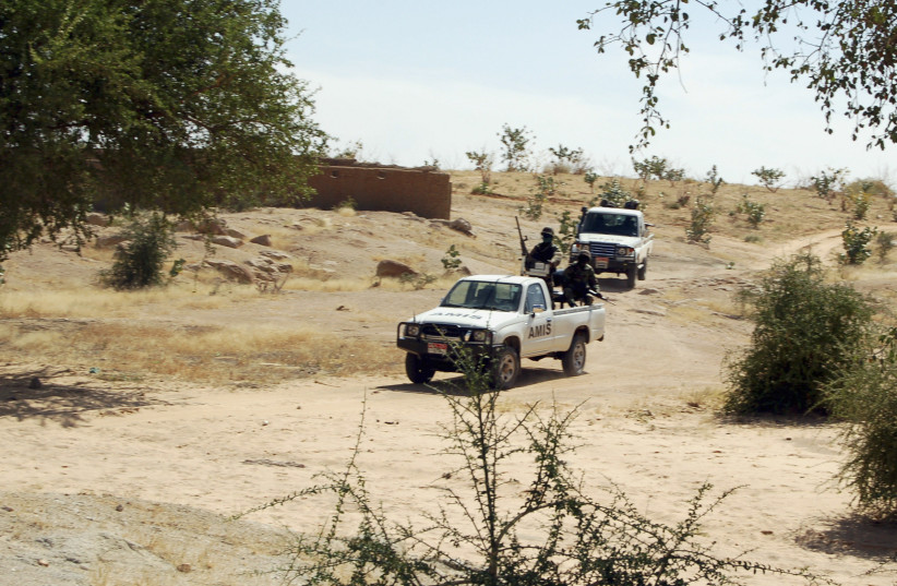  Africa Union vehicles patrol near the tense Sudan-Chad border town of Tine November 4, 2006. (credit: REUTERS/Opheera McDoom)