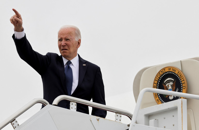  US President Joe Biden gestures as he boards Air Force One at Delaware Air National Guard Base, in New Castle, Delaware, US, April 25, 2022. (photo credit: TASOS KATOPODIS/ REUTERS)