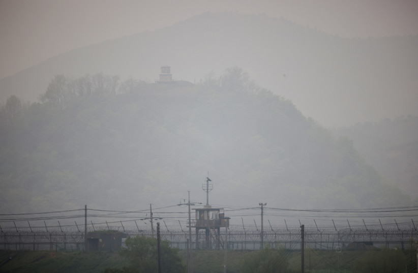 North and South Korean guard posts are seen near the demilitarized zone separating the two Koreas, in Paju, South Korea, April 25, 2022. (credit: REUTERS/KIM HONG-JI)