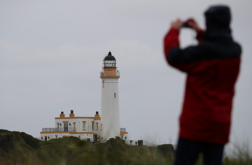 A view of the lighthouse on the Ailsa Championship Course at the Trump Turnberry Golf Resort in Turnberry, Scotland, Britain October 3, 2020. Picture taken October 3, 2020. (credit: REUTERS/RUSSELL CHEYNE)