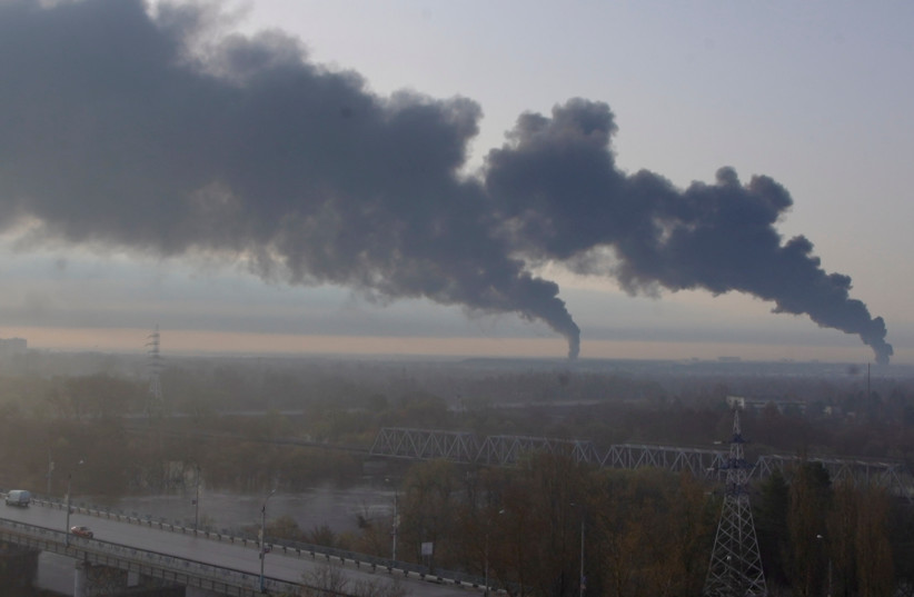  Plumes of smoke rise after a fire erupts at an oil depot in Bryansk, Russia April 25, 2022 in this still image obtained from social media video. (photo credit: Natalya Krutova via REUTERS)