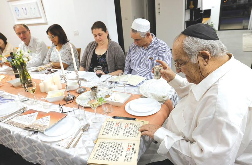  A PASSOVER SEDER is held earlier this month. How can we have a Seder to commemorate a time when all was out of order? (photo credit: NATI SHOHAT/FLASH90)