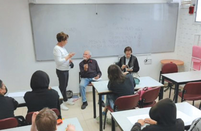  STUDENTS IN Eilat meet with a Holocaust survivor as part of the Creating Memory program. (photo credit: Tarbut community movement)