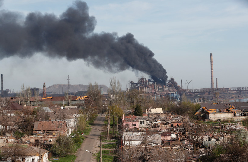  Smoke rises above a plant of Azovstal Iron and Steel Works during Ukraine-Russia conflict in the southern port city of Mariupol, Ukraine April 25, 2022. (credit: Alexander Ermochenko/Reuters)