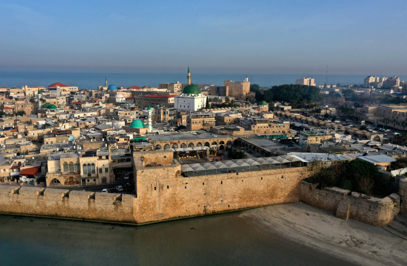  A picture taken on April 16, 2021, shows a general view of the old city of Acre, also known as Akko, located on the shore of the Mediterranean Sea in northern Israel.  (photo credit: MENAHEM KAHANA / AFP)