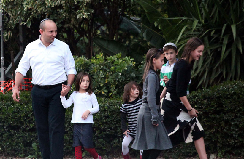  Naftali Bennett is seen outside his house with his family on January 25, 2013 (photo credit: Gideon Markowicz/Flash90)