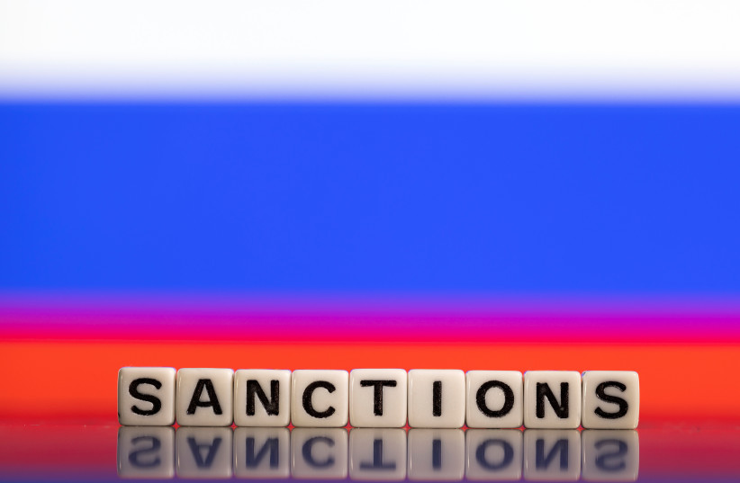  Plastic letters arranged to read ''Sanctions'' are placed in front of Russian flag colors in this illustration taken February 25, 2022. (credit: REUTERS/DADO RUVIC/ILLUSTRATION)