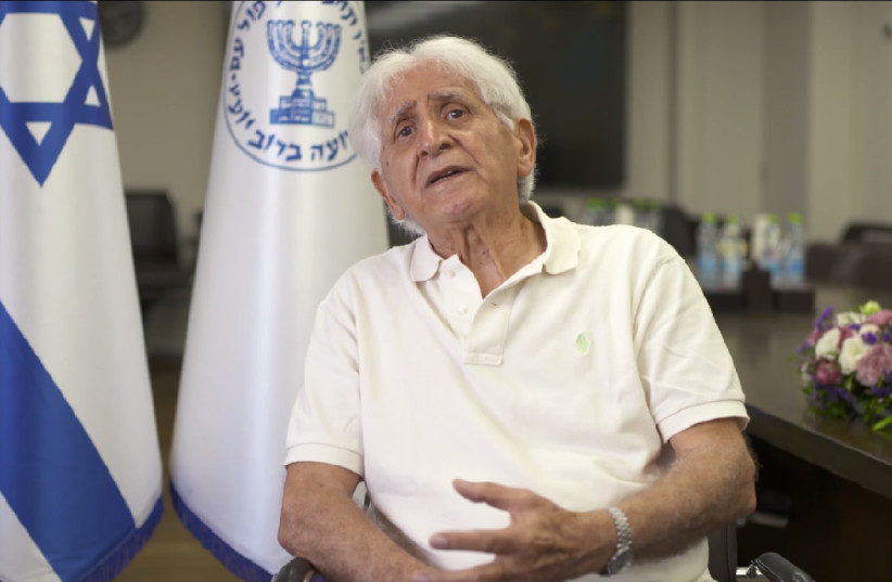 Mossad operative Chaim Victor Tayar gestures in a frame taken from a video in which shares his Holocaust testimony in the Mossad's Zikaron Basalon on 2022's Holocaust Remembrance Day. (credit: COURTESY OF THE MOSSAD)