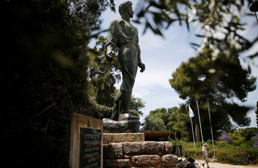  A monument to Mordechai Anielewicz, leader of the Warsaw Ghetto Uprising, is seen as a man prepares the area ahead of a ceremony marking Holocaust Remembrance Day at Kibbutz Yad Mordechai, in southern Israel May 4, 2016 (photo credit: AMIR COHEN/REUTERS)