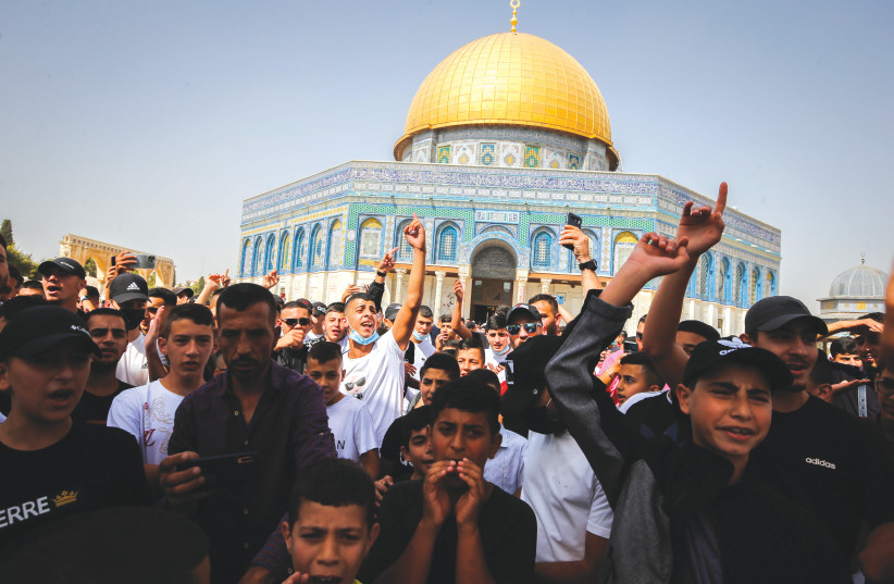 PALESTINIANS PROTEST against an Israeli judge’s approval of ‘quiet’ Jewish prayer on the Temple Mount, in October. (photo credit: JAMAL AWAD/FLASH90)