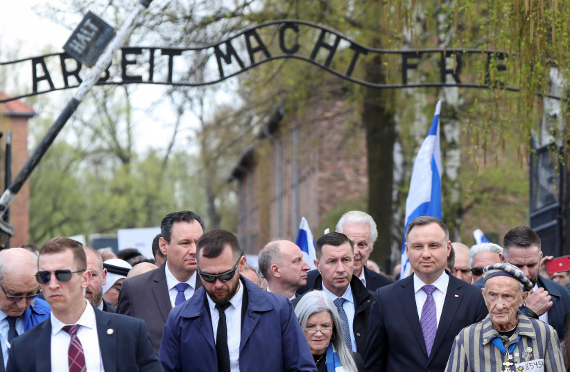  Polish President Andrzej Duda and Holocaust survivor Edward Mosberg attend the annual International ''March of the Living'' through the grounds of the former Auschwitz death camp, in Oswiecim, Poland April 28, 2022. (credit: REUTERS/KACPER PEMPEL)