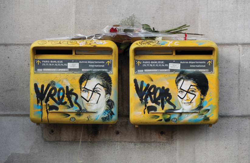  OCCUPATIONALISM’S CONSEQUENCES for Jews: Vandalized mailboxes with swastikas covering portraits of late Holocaust survivor and renowned French politician Simone Veil, in Paris, 2019.  (credit: BENOIT TESSIER/REUTERS)