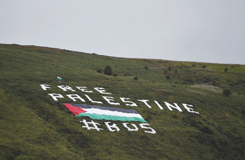  ‘FREE PALESTINE’ message on a hill outside Windsor Park stadium in response to a 2018 Northern Ireland vs Israel football match, in Belfast, N. Ireland. (credit: CLODAGH KILCOYNE/REUTERS)