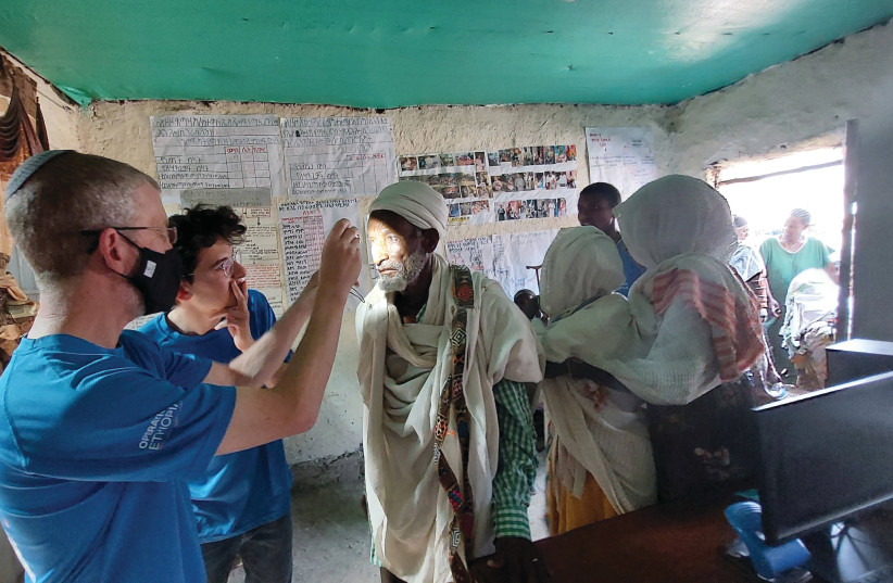 IN ACTION in Ethiopia: Eye checks.  (photo credit: Courtesy Morris Hartstein)