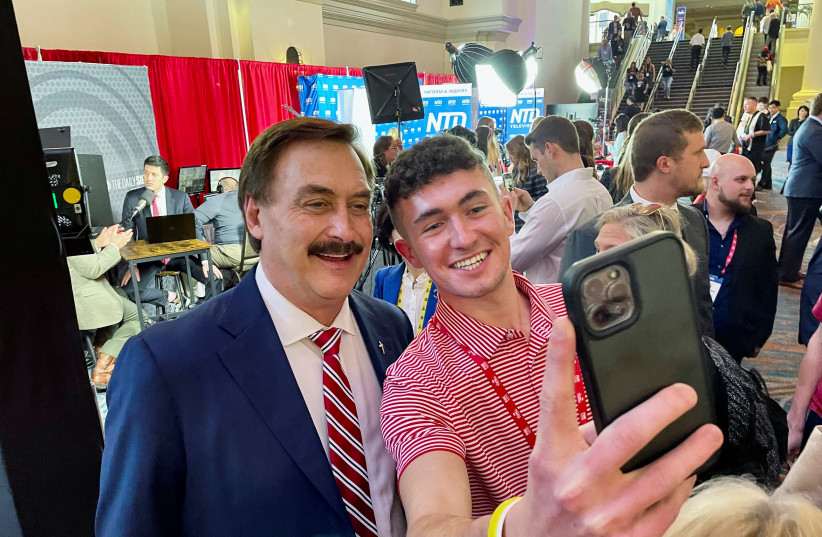  MyPillow CEO Mike Lindell, one of the nation’s most prominent Trump backers, poses for a selfie at the conservative CPAC conference in Orlando, Florida on February 24, 2022. (photo credit: REUTERS/Alexandra Ulmer)