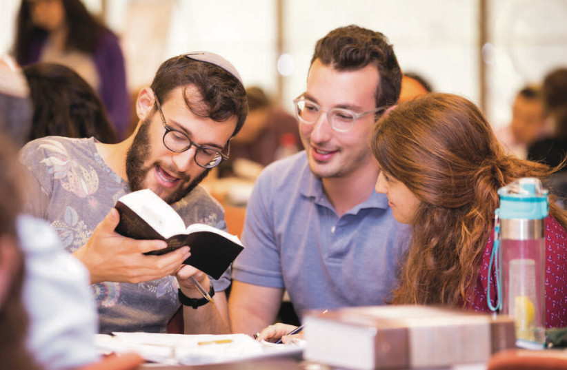 Hadar students read a piece of text together. (photo credit: YESHIVAT HADAR)