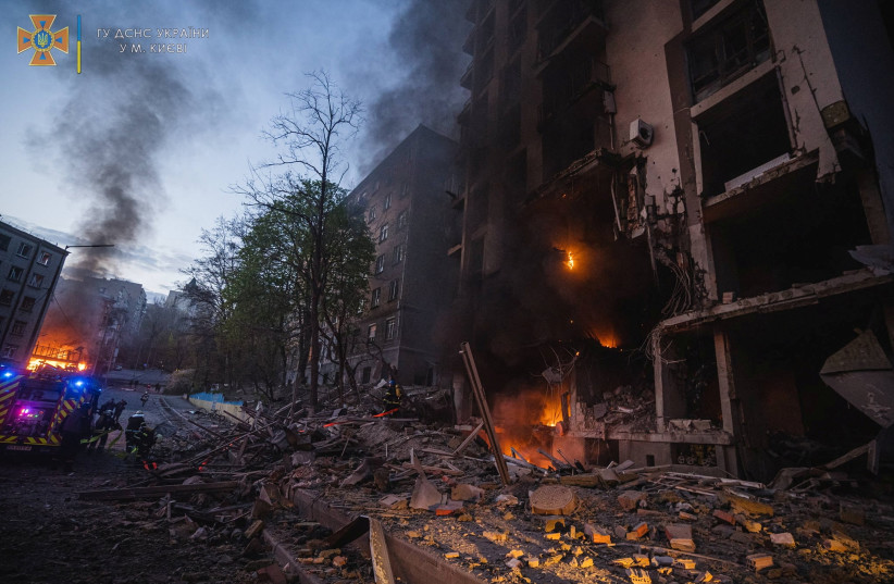  Rescuers work at a site of a residential building damaged by a missile strike, as Russia's attack on Ukraine continues, in Kyiv, Ukraine, in this handout picture released on April 29, 2022. (photo credit: State Emergency Service of Ukraine/Handout via REUTERS)