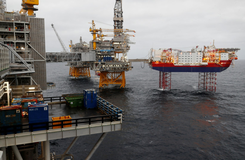 Equinor's Johan Sverdrup oilfield platforms and accommodation jack-up rig Haven are pictured in the North Sea, Norway December 3, 2019.  (photo credit: REUTERS/Ints Kalnins/File Photo)