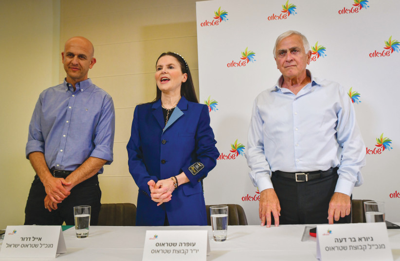  OFRA STRAUSS is flanked by top Strauss Group executives Giora Bardea (right) and Eyal Dror at a news conference regarding salmonella in their chocolate products, at Strauss headquarters in Petah Tikva, last week. (photo credit: AVSHALOM SASSONI/FLASH90)