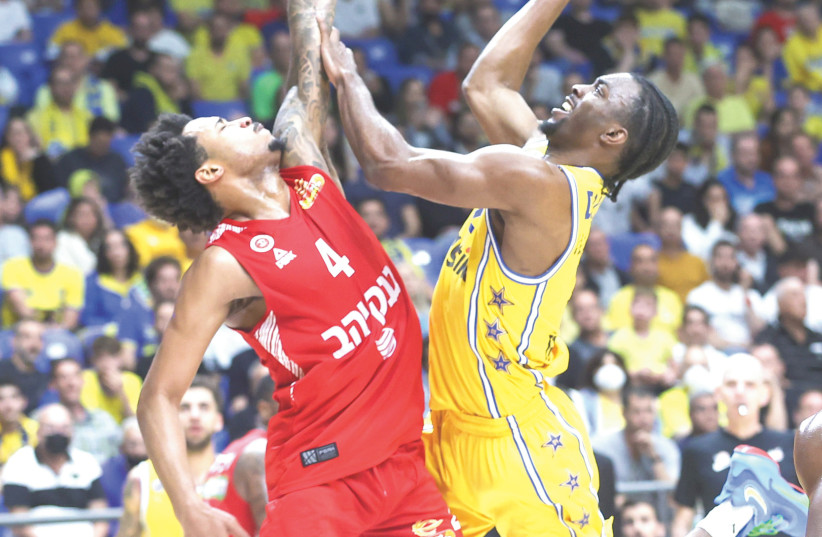  MACCABI TEL AVIV guard Keenan Evans (right) goes to the hoop against Hapoel Jerusalem’s Jalen Adams during the yellow-and-blue’s 89-79 home victory over the Reds.  (credit: DANNY MARON)