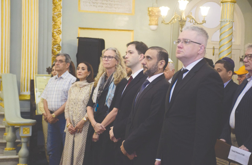  REENA PUSHKARNA (left, in light-colored dress), stands with diplomats at the Knesset Eliyahoo Baghdadi synagogue in Mumbai.  (credit: REENA PUSHKARNA)