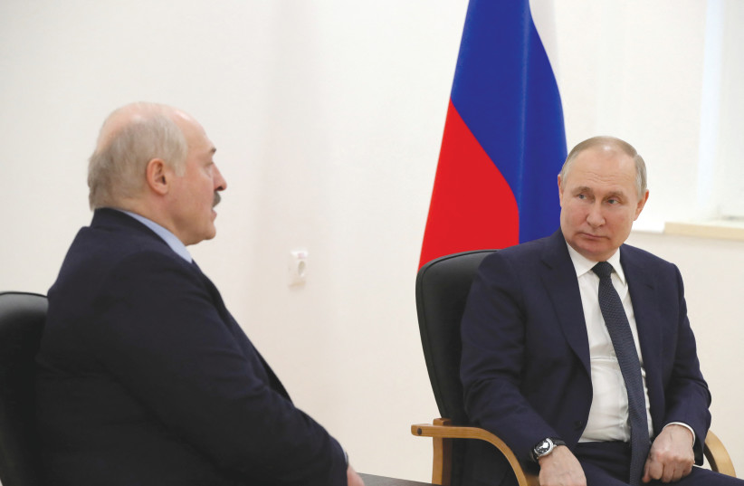 Russian President Vladimir Putin listens to Belarusian President Alexander Lukashenko during a meeting in Russia last month. Lukashenko has said Armenia can’t avoid Russia bringing it into an axis with Belarus.  (credit: Sputnik/Kremlin/Reuters)