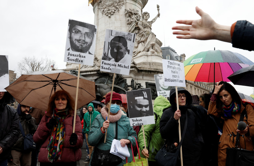  Demonstrators gather at the Place de la Republique square, to protest against antisemitism and commemorate the 2012 Toulouse attack against a Jewish school that left three children and an adult dead, in Paris, France March 13, 2022 (photo credit: REUTERS/BENOIT TESSIER)