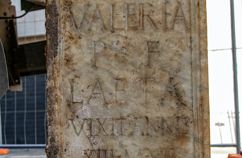 ''Valeria Laeta lived 13 years and 7 months.'' An inscription in white marble gives the story of a girl who lived, according to the first findings, in the second century CE. (credit: FABIO CARICCHIA/ITALIAN MINISTRY OF CULTURE)