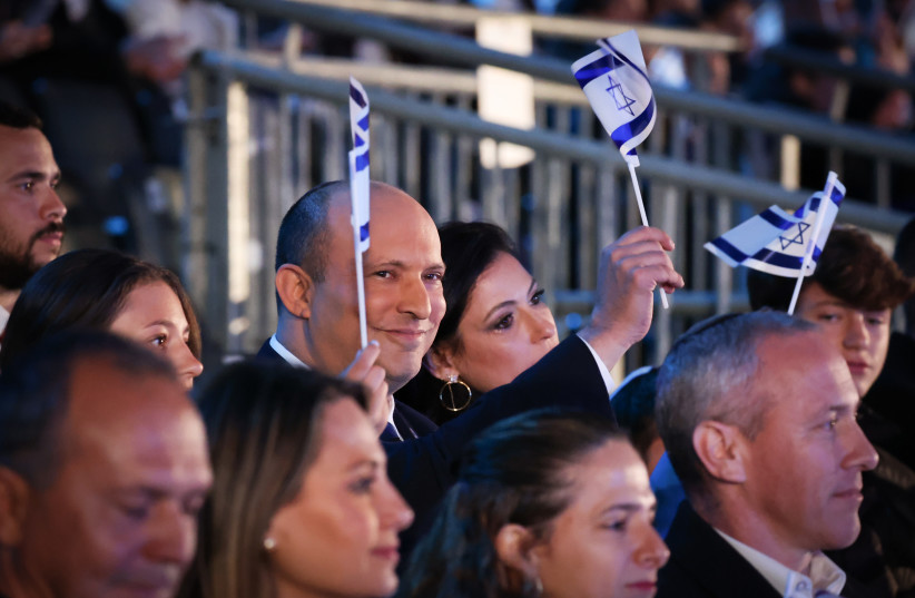  Israeli Pm Naftali Bennett and his wife enjoy the 74th anniversary Independence Day ceremony, held at Mount Herzl, Jerusalem on May 04, 2022. (photo credit: YONATAN SINDEL/FLASH90)