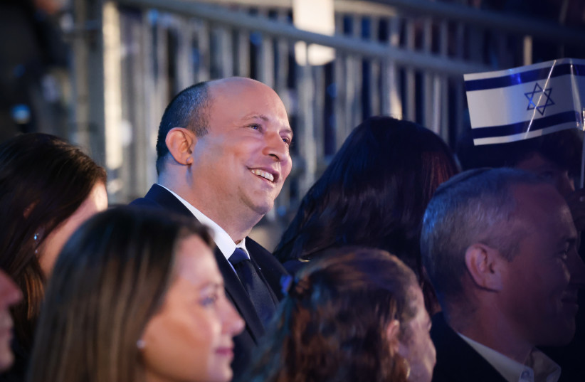  Israeli Pm Naftali Bennett and his wife enjoy the 74th anniversary Independence Day ceremony, held at Mount Herzl, Jerusalem on May 04, 2022. (credit: YONATAN SINDEL/FLASH90)