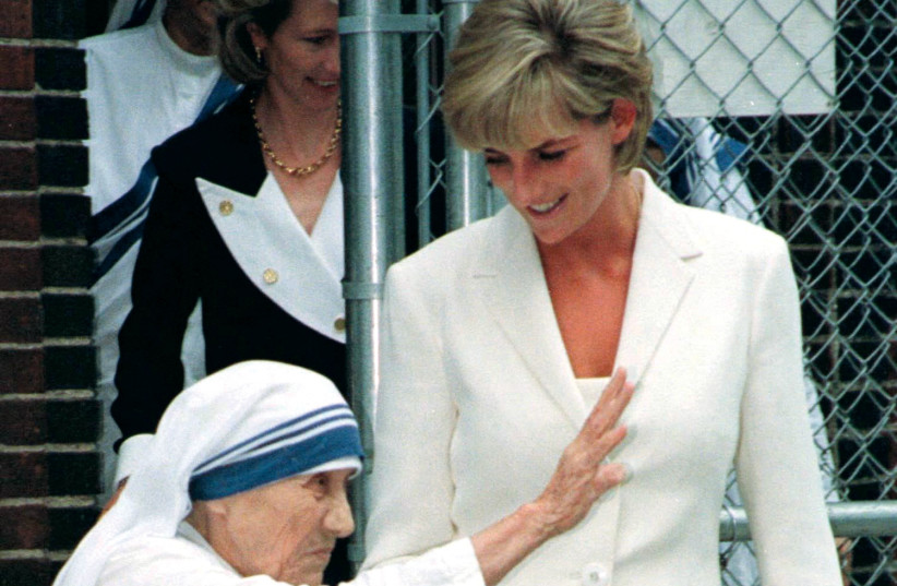  Mother Teresa holds hands with Princess Diana outside the Missionaries of Charity’s residence in New York City in 1987. (credit: REUTERS)