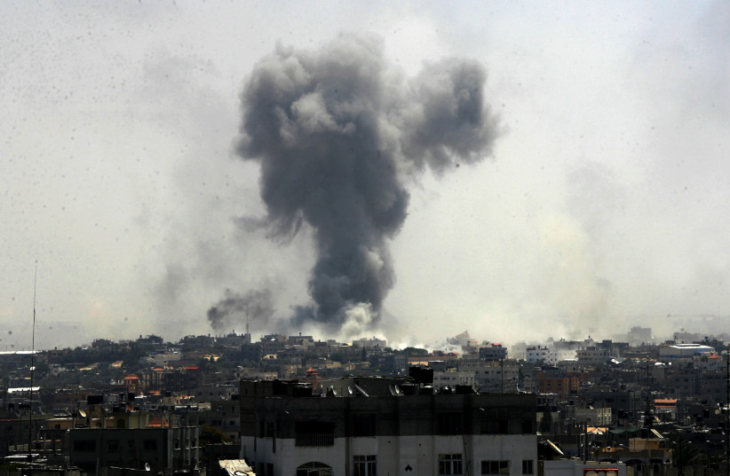 SMOKE RISES following Israeli airstrikes in Rafah on ‘Black Friday,’ August 1, 2014. (credit: ABED RAHIM KHATIB/FLASH90)